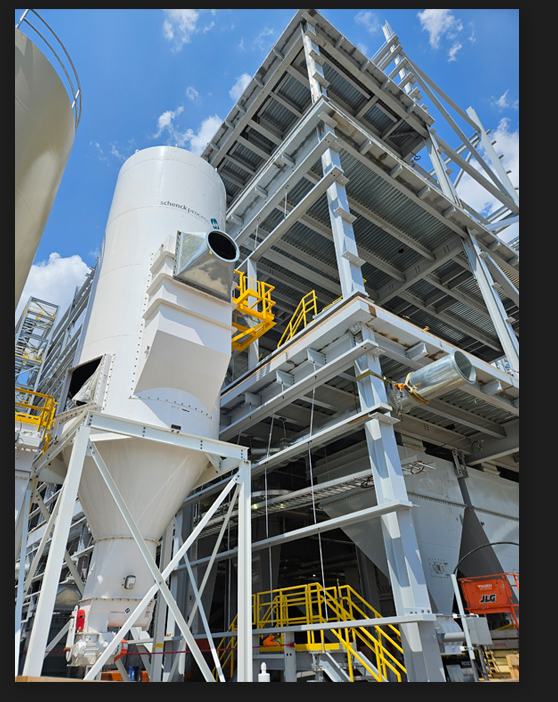 A vessel being installed on an industrial construction site.