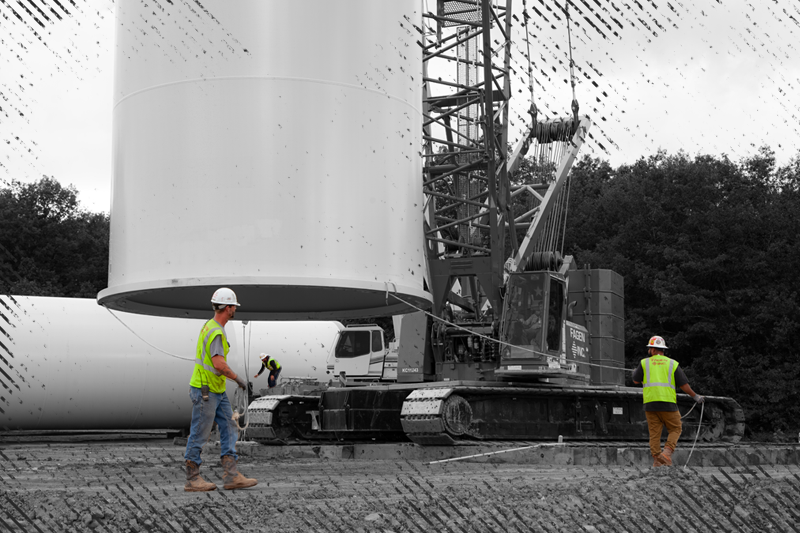 Fagen, Inc. employees setting base of a wind tower.
