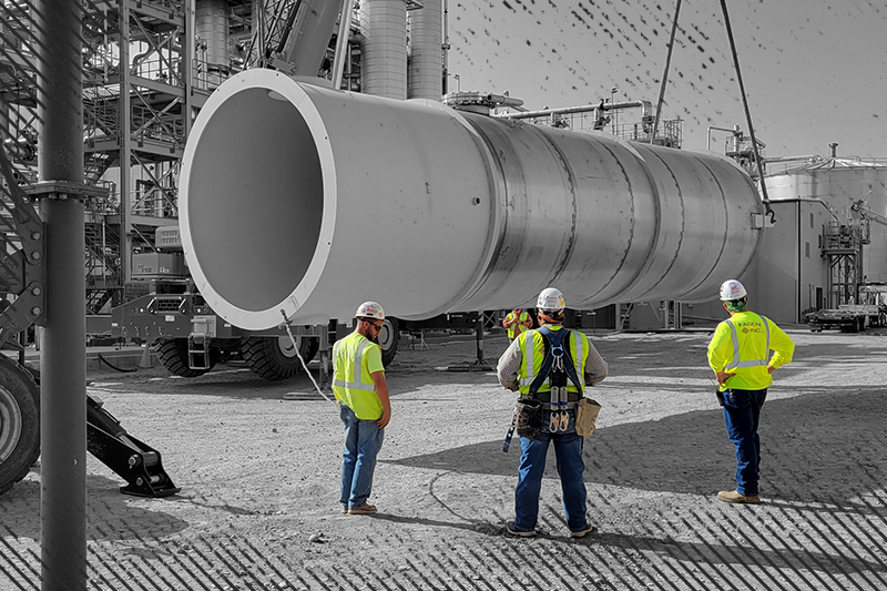 Millwrights erecting a column.